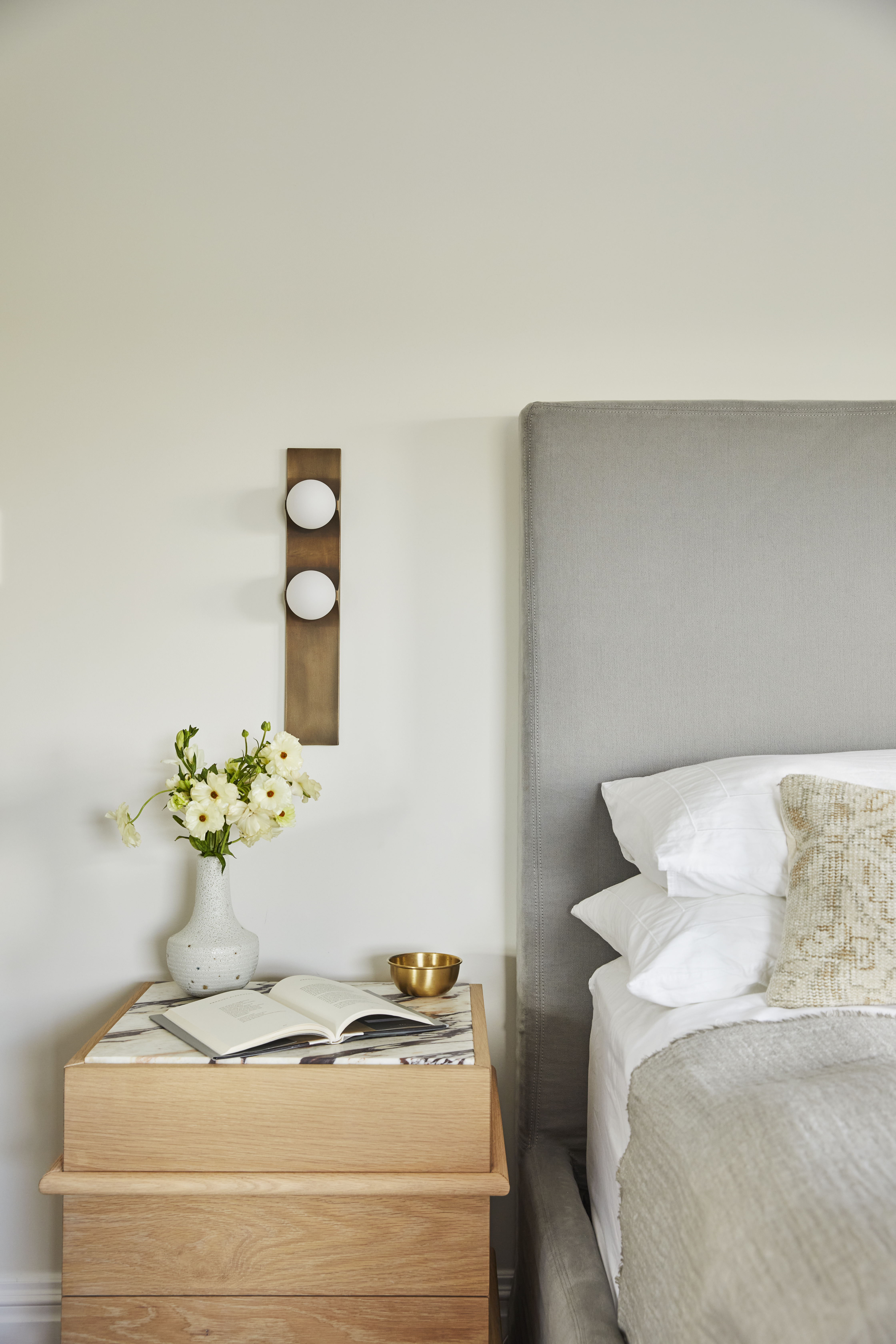 close up a bedroom wall with eggshell paint in white dove color